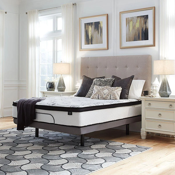 White mattress in empty bedroom