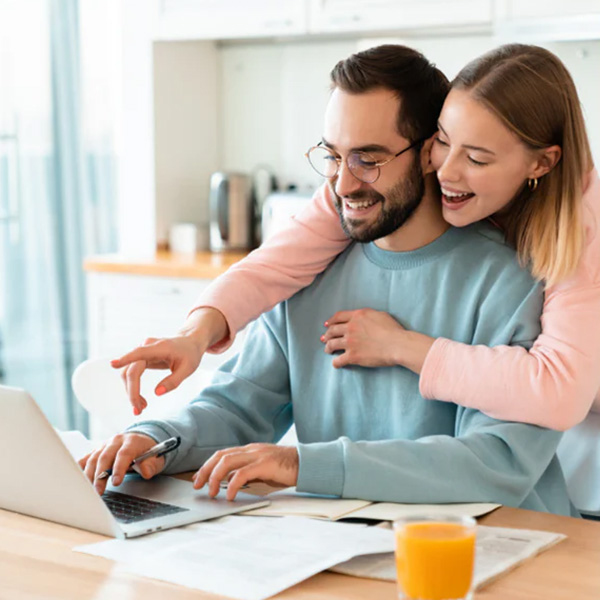 Couple looking at financial options online